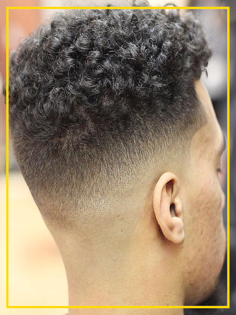 O Mid Fade no fio crespo.